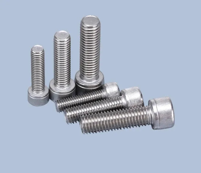 Stainless steel cartridge mounting screw set with allen bolts, nuts, washers, and two allen keys on a grey background.