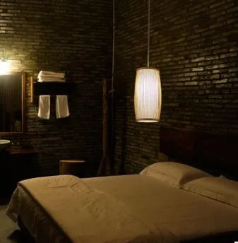 Bamboo plait wall lamp with woven construction and E27 lamp holder