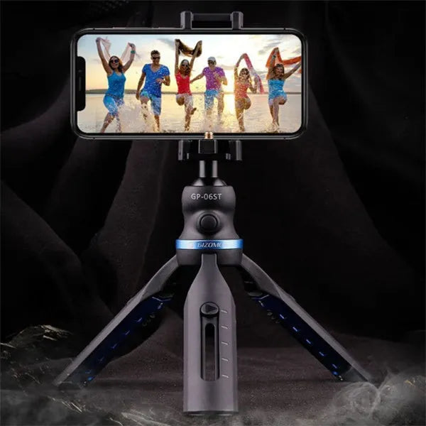 Black plastic and aluminium desktop tripod stand holding a mobile phone.