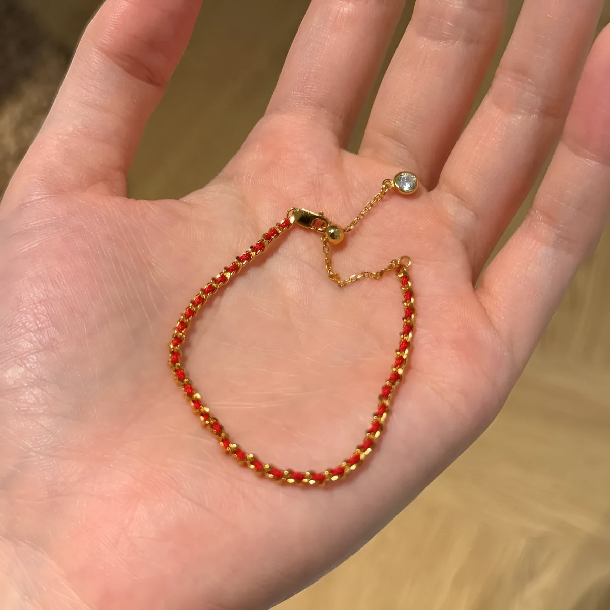 Women's 925 sterling silver bracelet with red rope, gold electroplated finish, and geometric ring design
