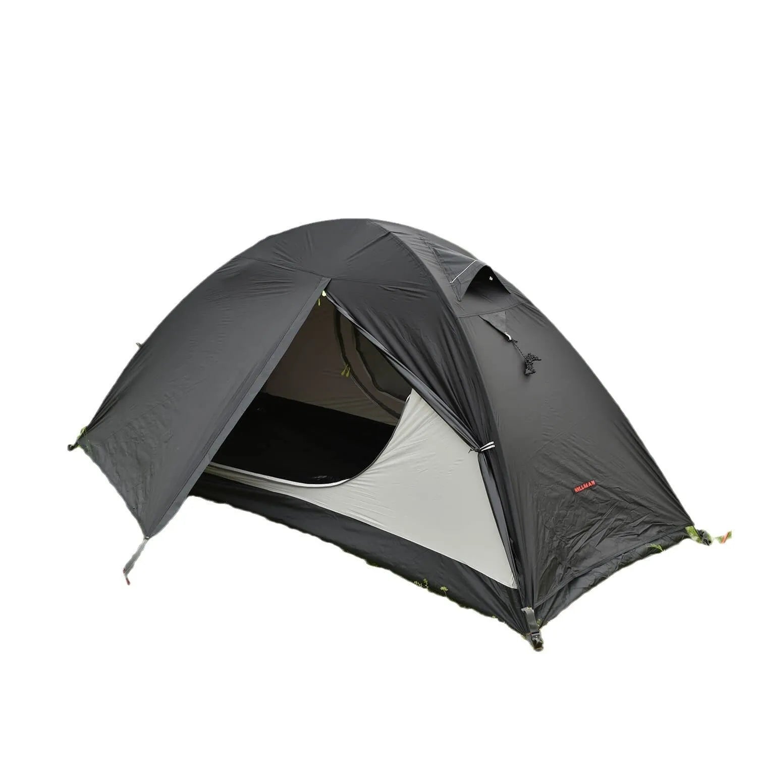 Single person orange double-layer hiking tent pitched in a field with aluminium poles visible.