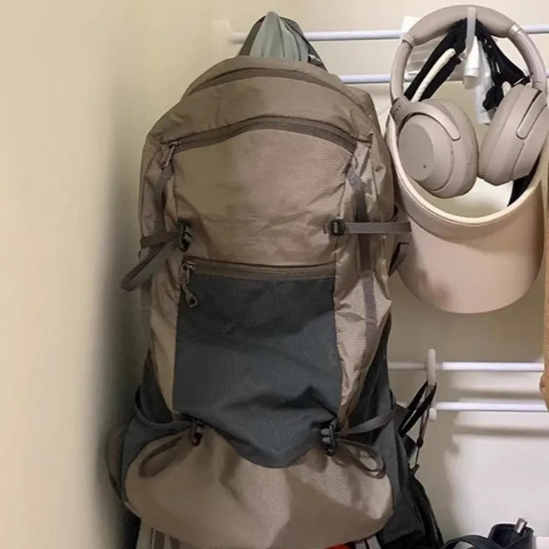 Lightweight waterproof nylon backpack 20-35L in natural Renaissance khaki light with curved shoulder straps and contrast colour detail