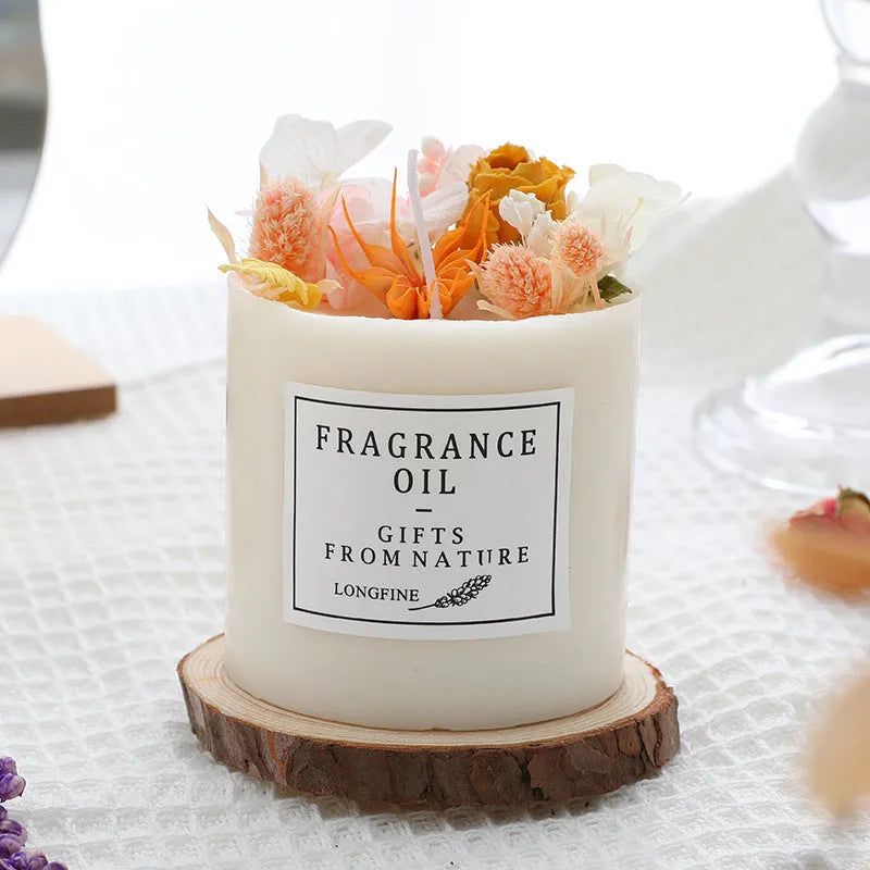 Decorative dried flower scented candle with choice of nine aromas on a wooden chip base.