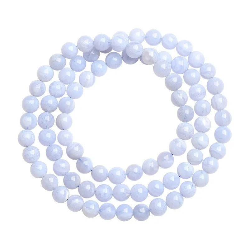 Blue agate beaded bracelet with three strands and a silver Ruyi-style clasp.