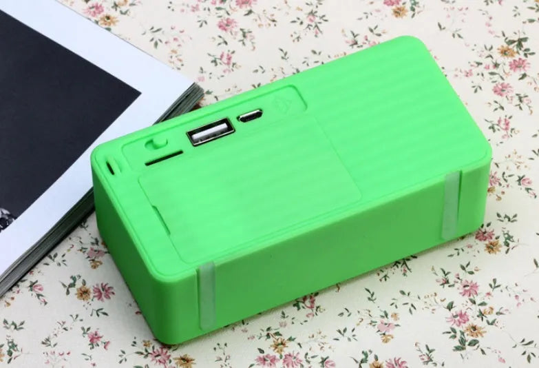 Cannon X3 small cube-shaped wireless Bluetooth speaker in chosen colour on a surface