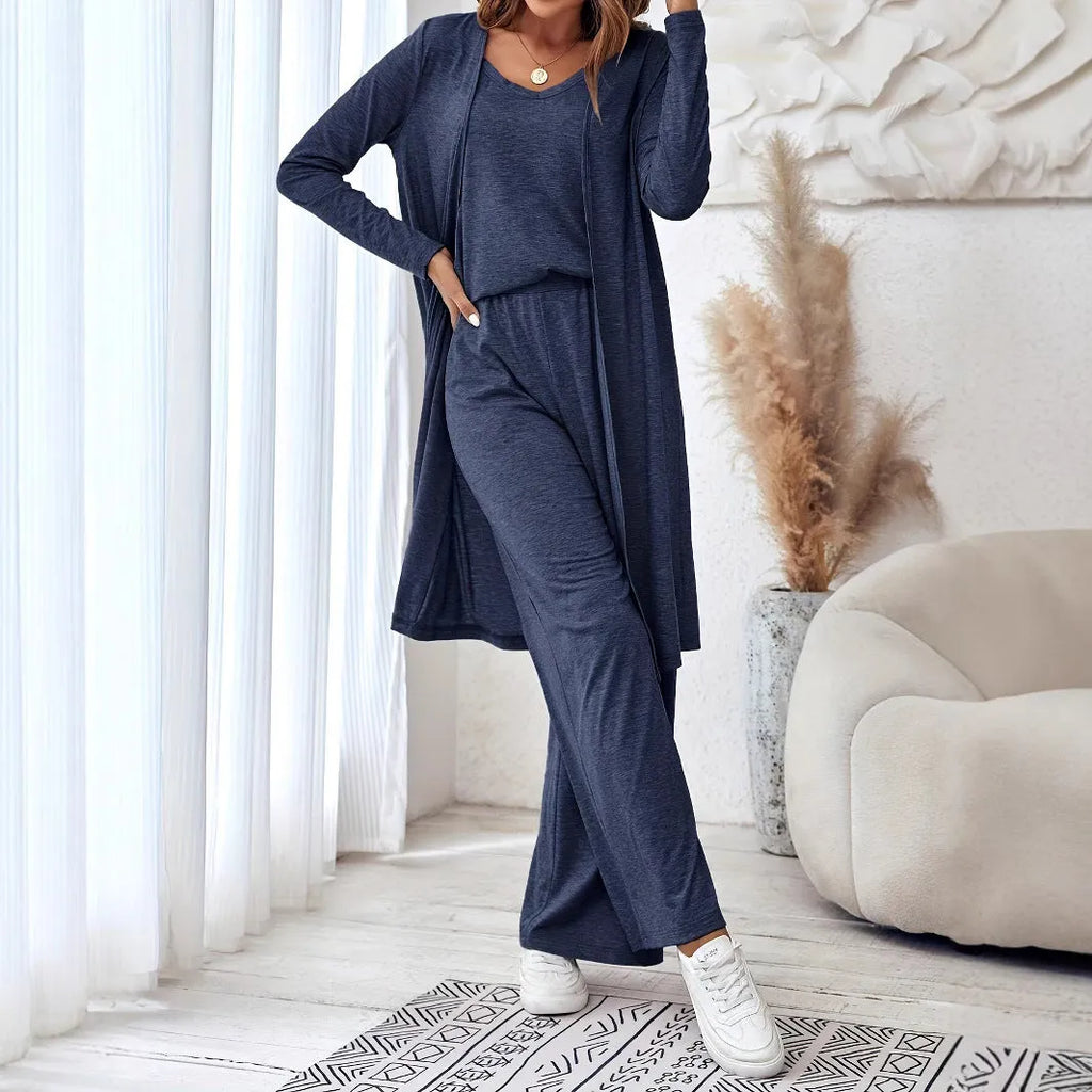 Blue women's three-piece casual suit with sling top, cardigan, trousers, and suspenders.