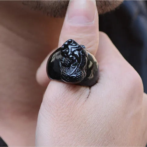 Men's domineering obsidian crystal pixiu thumb ring with gold sheen details on an alloy band.