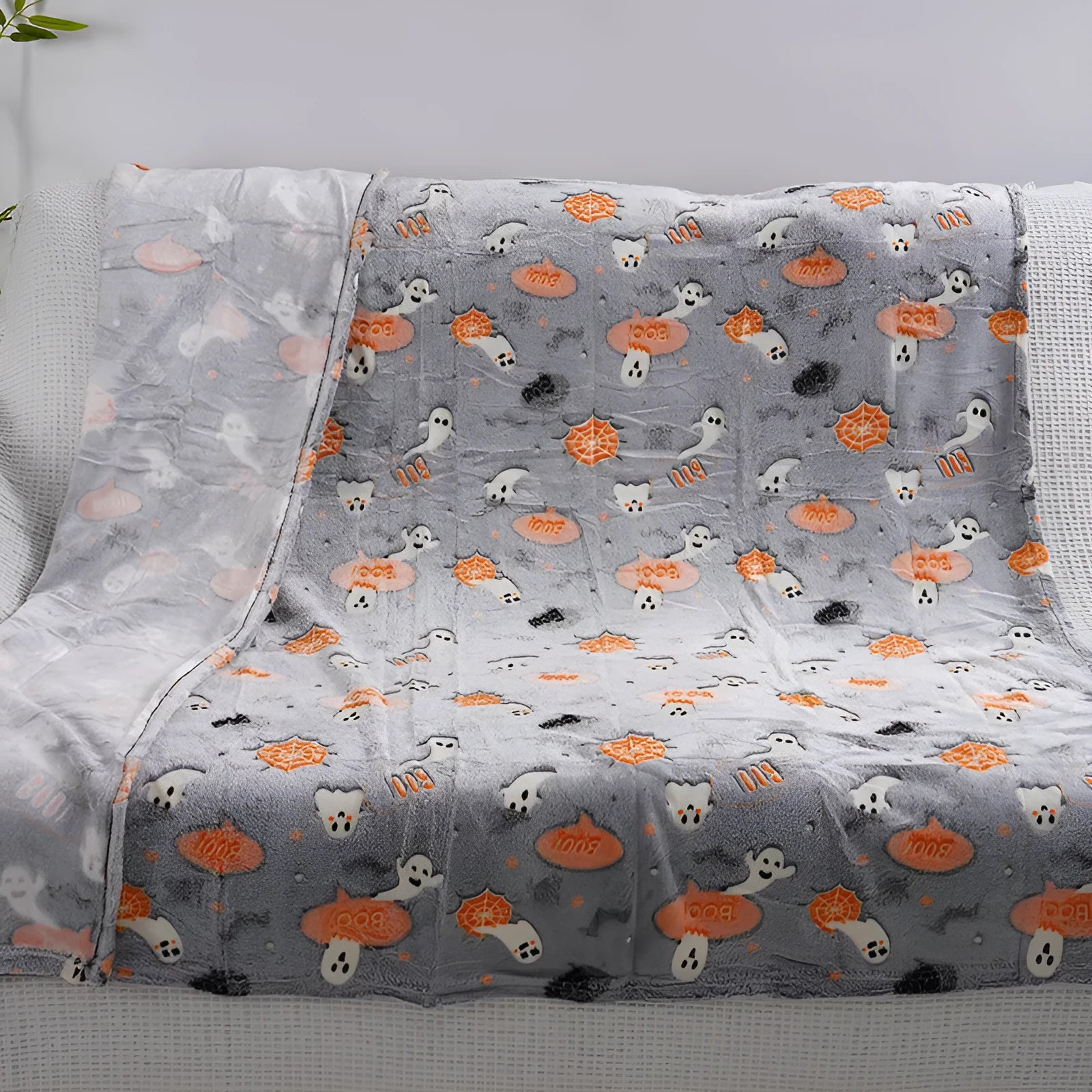 Cartoon-patterned flannel blanket draped over a child's air conditioning unit.
