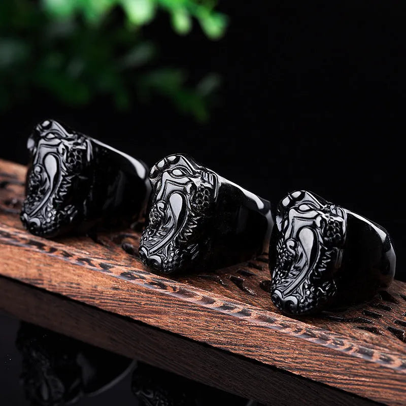 Men's domineering obsidian crystal pixiu thumb ring with gold sheen details on an alloy band.