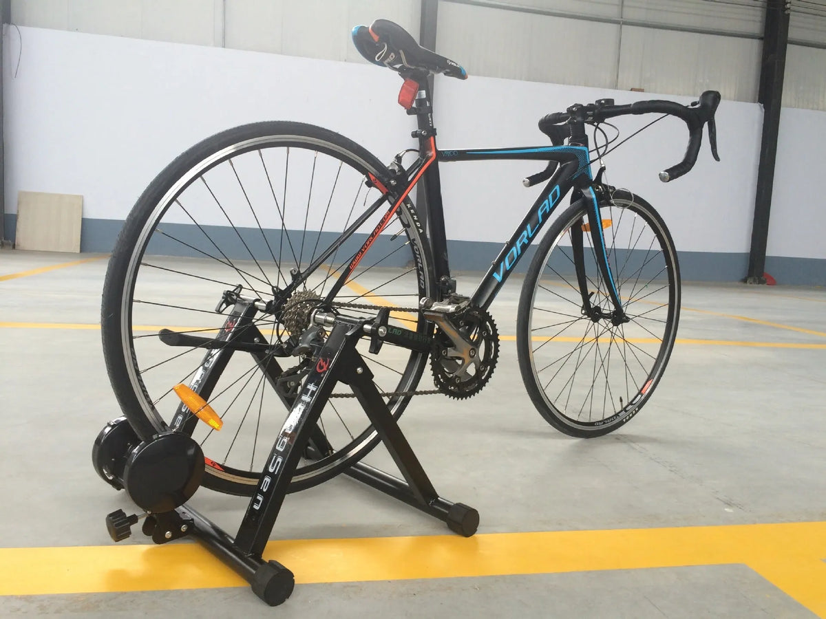 Indoor cycling training platform with magnetoresistance line control and fixed parking frame for 66-69cm bikes, black
