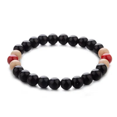 Natural stone essential oil bracelet with lava stone beads on wrist, showing ethnic style unisex design