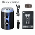Black mini portable rechargeable electric shaver with USB cable and cleaning brush on a white background.
