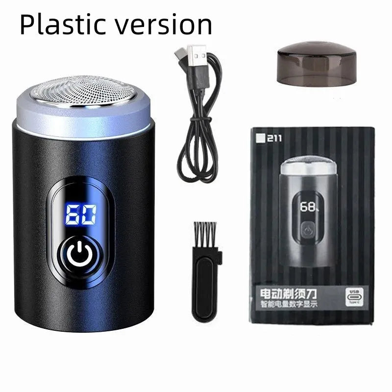 Black mini portable rechargeable electric shaver with USB cable and cleaning brush on a white background.