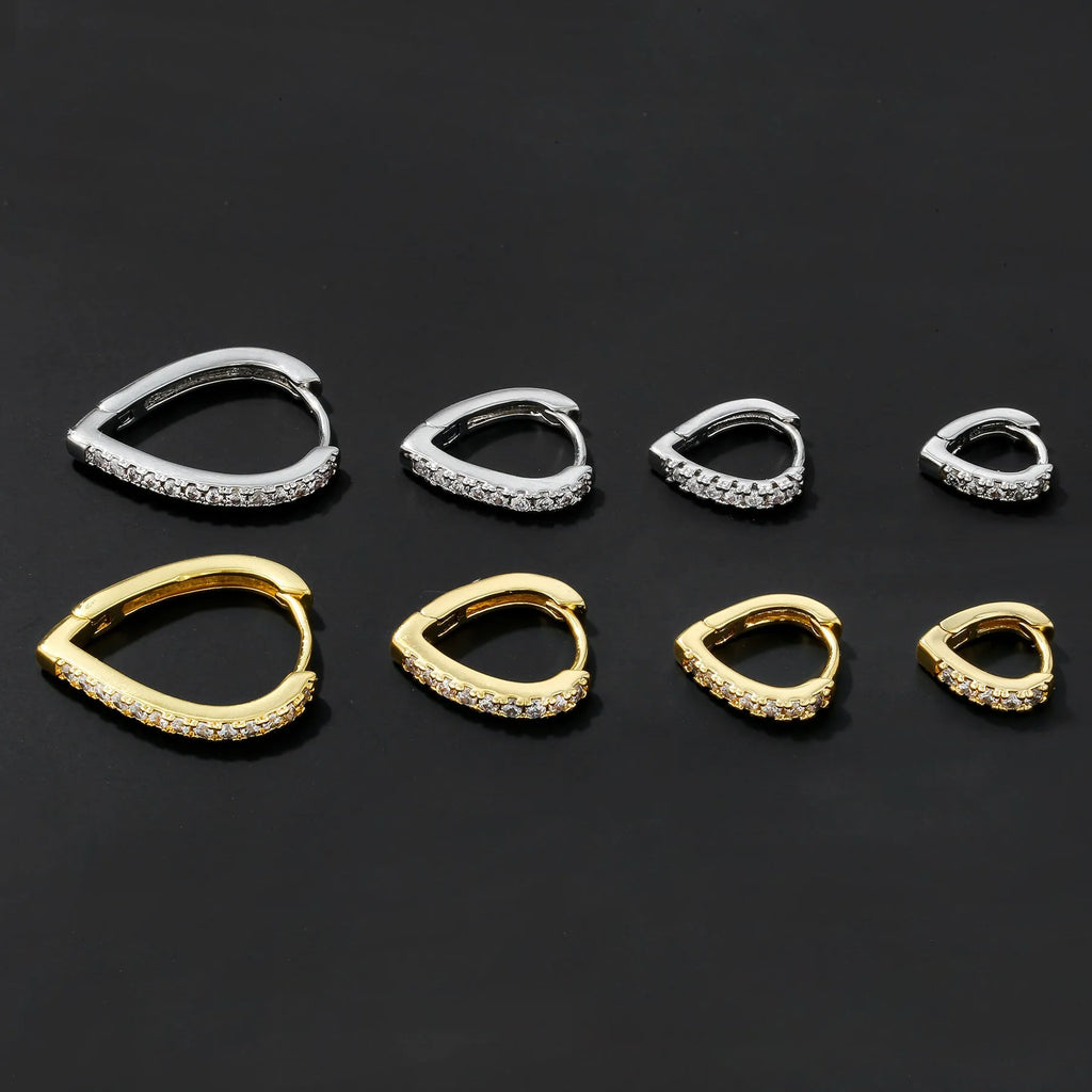 Geometric copper love heart ear clip with electroplated gold finish, shown on a white background.