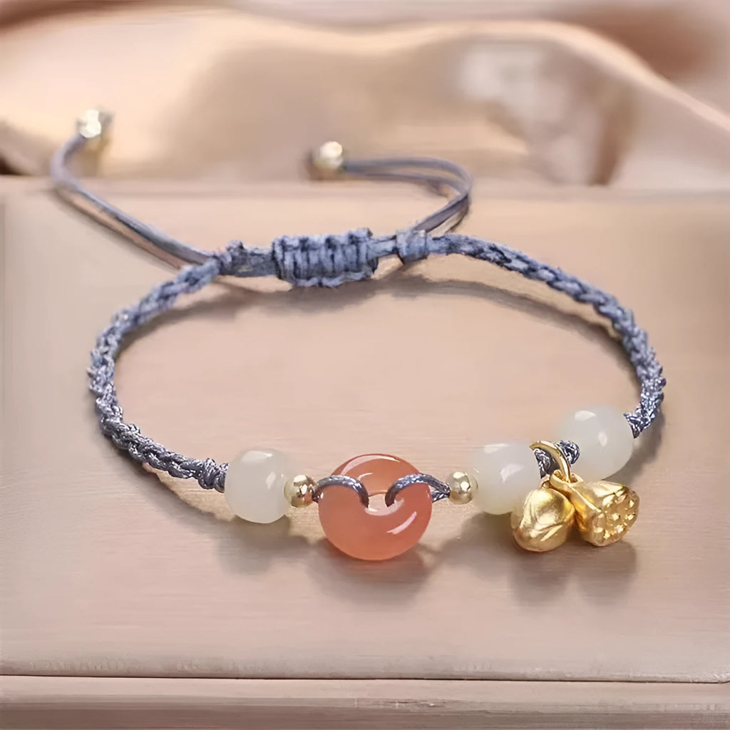 Women's Hetian jade bracelet with peace buckle charm, constellation detailing, and adjustable shihuan closures