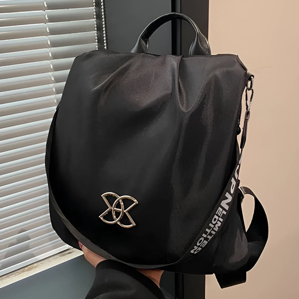 Women's black travel backpack with contrast stitching, large capacity, and three-dimensional outer pocket