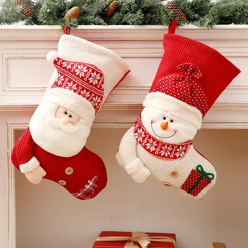 Large red and white knitted Christmas stocking with Santa Claus design for fireplace mantel decoration