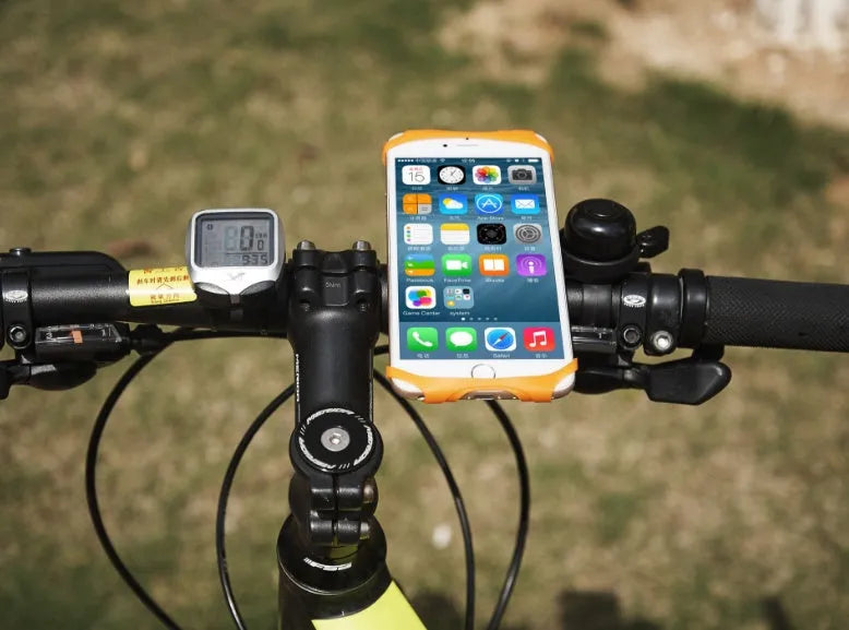 Silicone bicycle phone holder mounted on handlebar with three adjustment holes visible