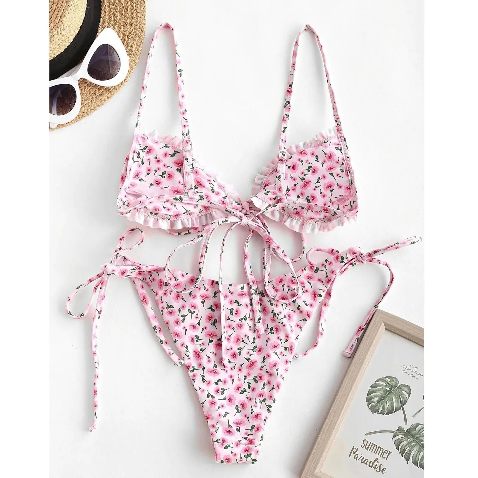 Blue printed women's bikini with multi-rope banding detail on short sleeves and lapel collar.
