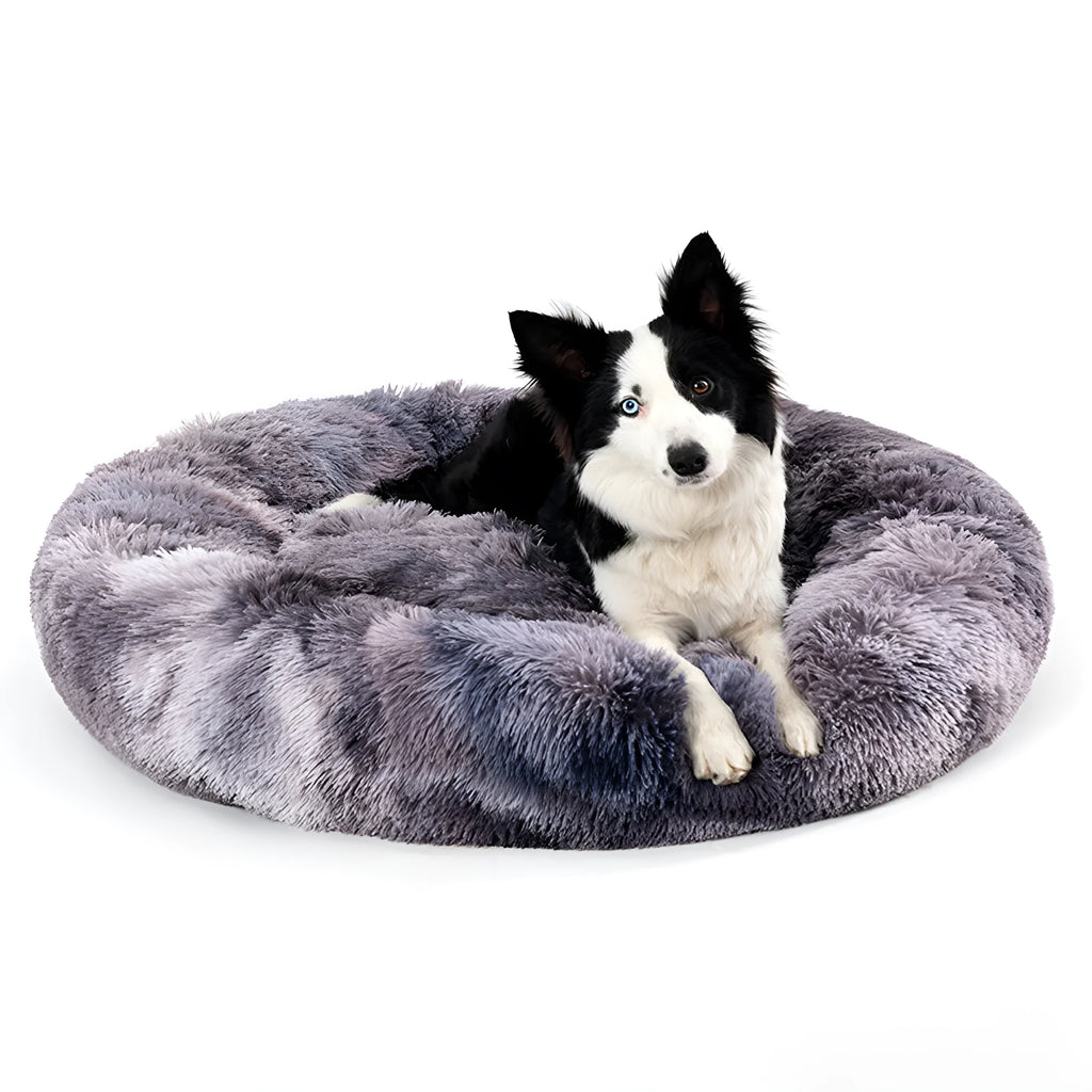 Fluffy donut-shaped pet bed in long plush fabric, showing raised rim, available in multiple colours.
