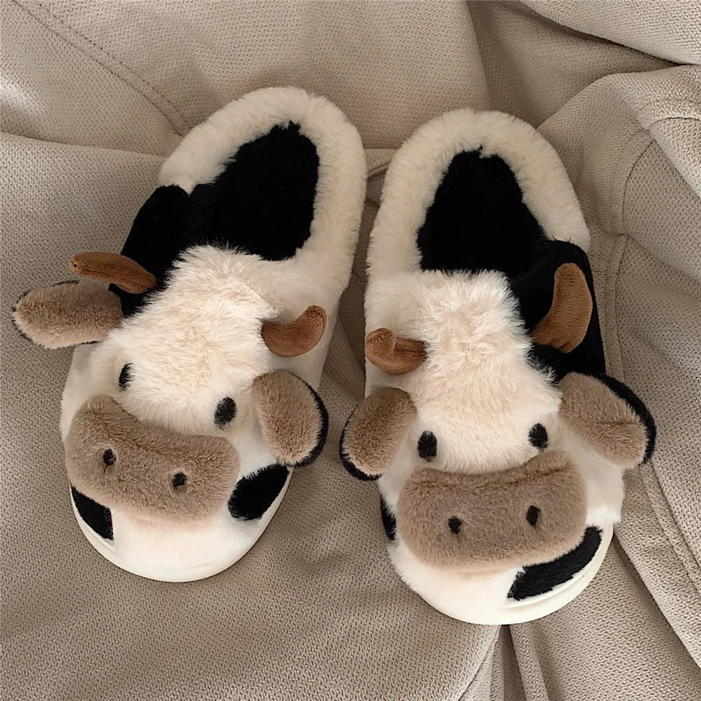White cow plush slippers with cartoon milk cow pattern and non-slip textured sole