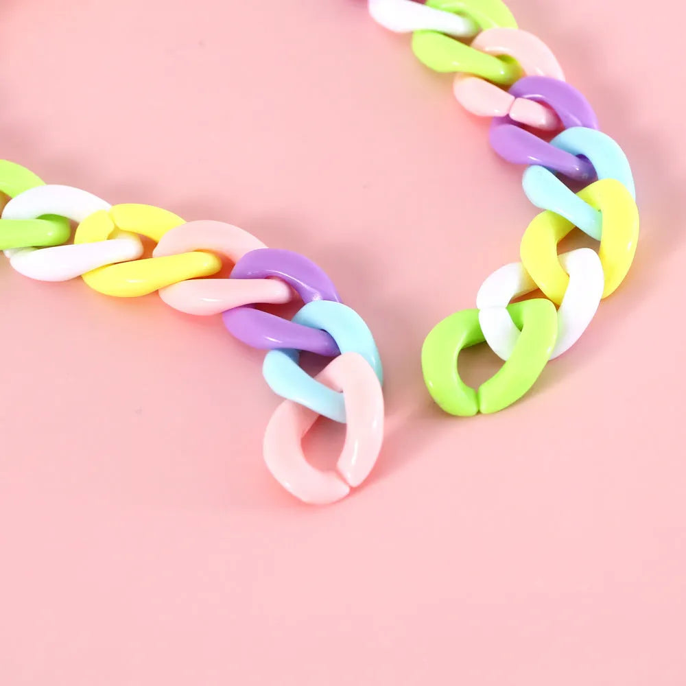Macaron candy coloured plastic pet collar for cats, dogs and rabbits on a white background.