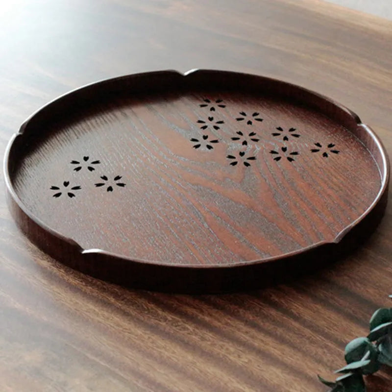 Wooden shallow plate with carved hollow cherry blossom pattern, 30cm in diameter.
