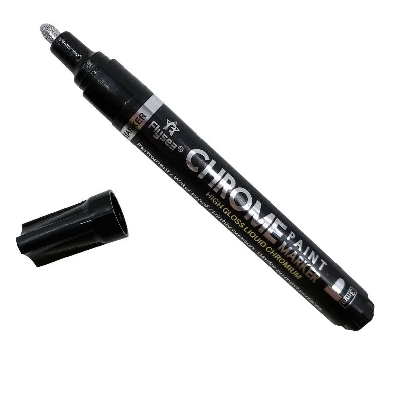 Chrome-plated reflective paint marker pen with 3.0mm tip on glass surface showing silver writing