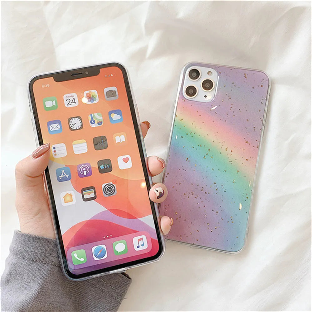 Colourful rainbow gradient striped TPU protective case for various iPhone models on a white background.