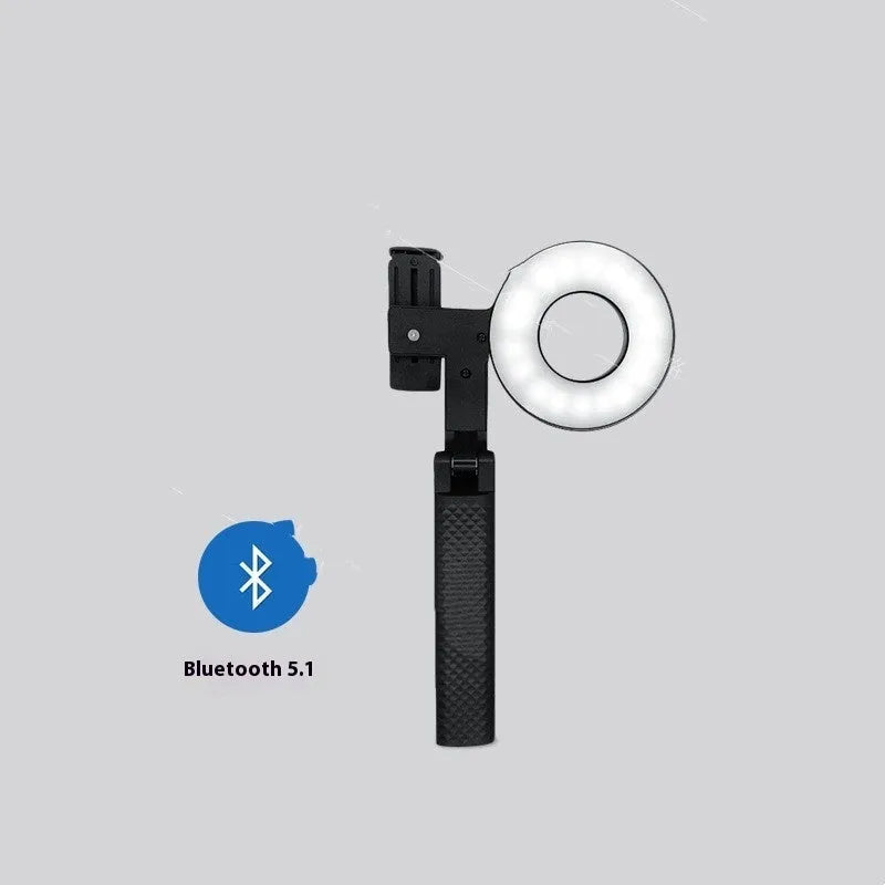 Black handheld LED fill light for mobile phone photography, showing compact portable design.
