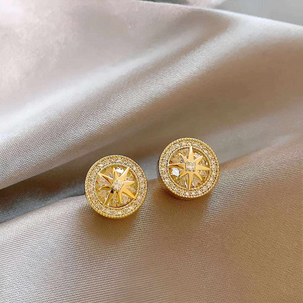 Pair of copper eight-pointed star stud earrings with real gold plating and inlaid zircon