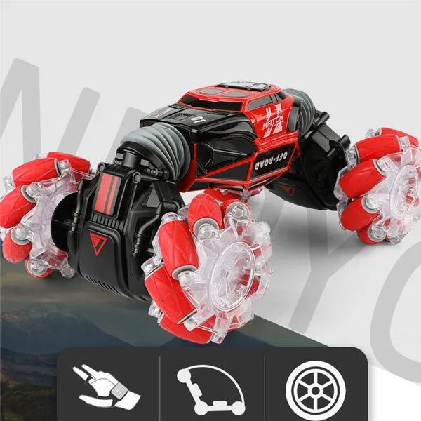 4WD RC stunt car with gesture remote control in red colour on white background showing off-road wheels and LED lights