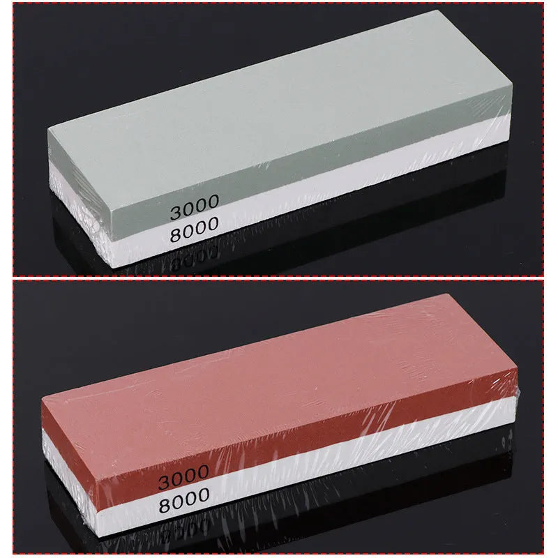 Red and white dual-grit kitchen whetstone on a bamboo base with sharpening accessories.