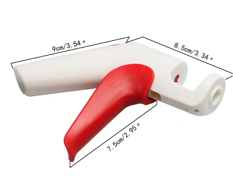 Stainless steel manual cherry pitter tool with protective end caps on a wooden surface.