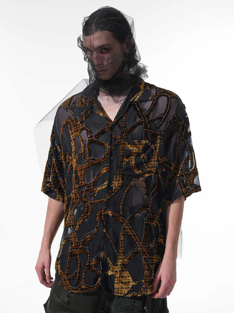 Man modelling a black and grey snake pattern translucent short-sleeved loose-fit shirt