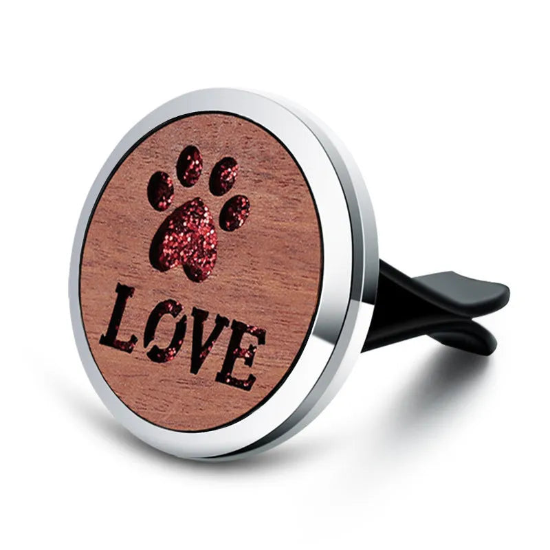 Round car vent aromatherapy clip in alloy wood construction showing hollow centre for incense
