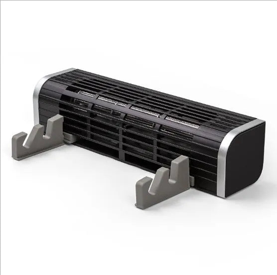 Black notebook cooling pad with dual fans for a 17-inch laptop on a desk