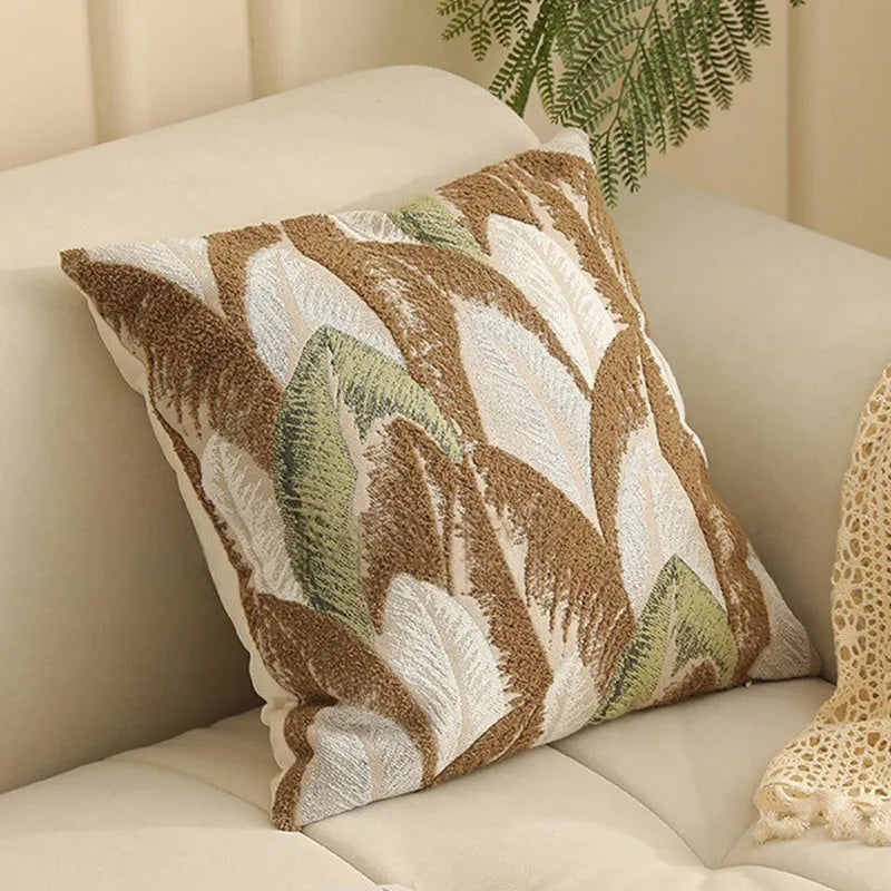 Square 45cm jacquard cushion cover with retro floral pattern in Nordic style on a grey sofa.