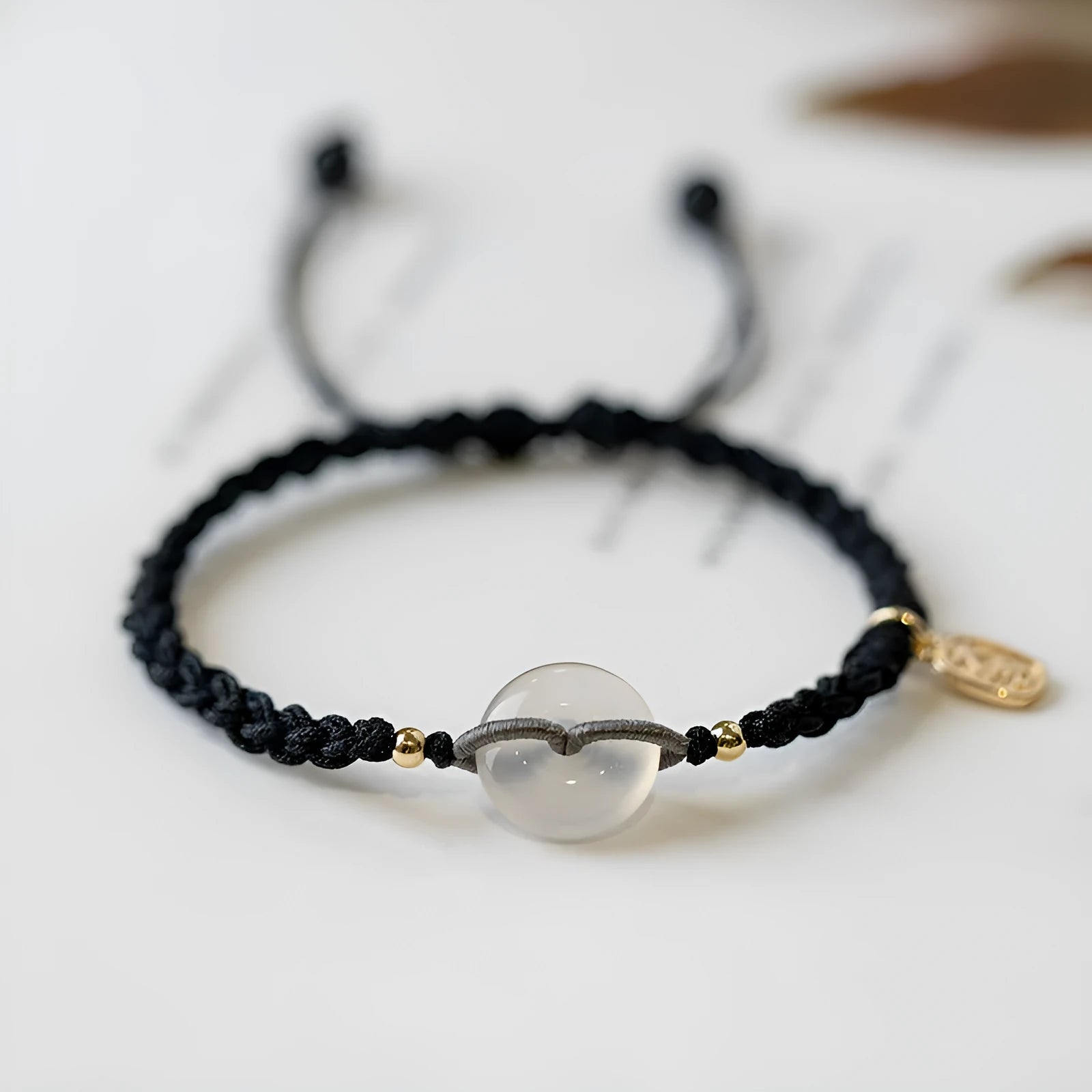 Woven crystal bracelet with flower motifs and ethnic design in black or double colour rope