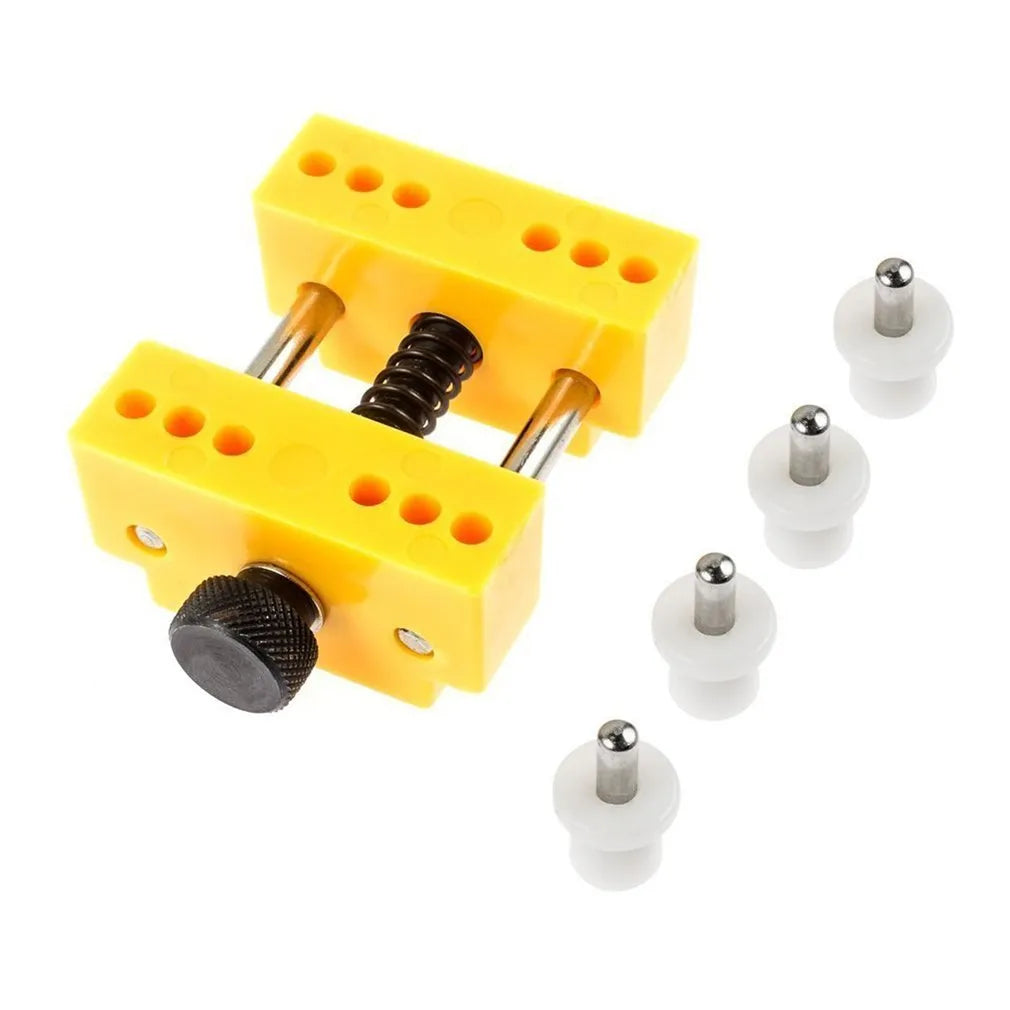 Yellow plastic watch case opener tool and fixing base with four pillars for DIY repair.