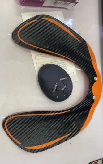 Compact EMS hip muscle training stimulator device with adhesive gel pads for buttocks and abdomen.