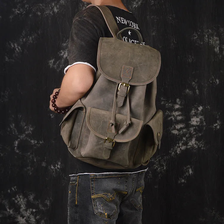 Men's leather drawstring backpack in first layer cowhide, retro style, 30cm x 15cm x 40cm, with curved shoulder strap and soft handle.