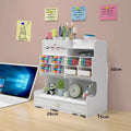 Square white plastic pen storage box with multiple oblique insertion grid compartments for organisation.