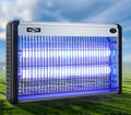 Electric mosquito killing lamp with UV light tube and internal grid for indoor fly and insect control.