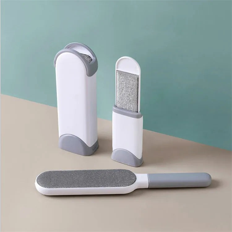 Electrostatic hair removal brush with polyester yarn bristles, two sizes and colour options, on a fabric surface