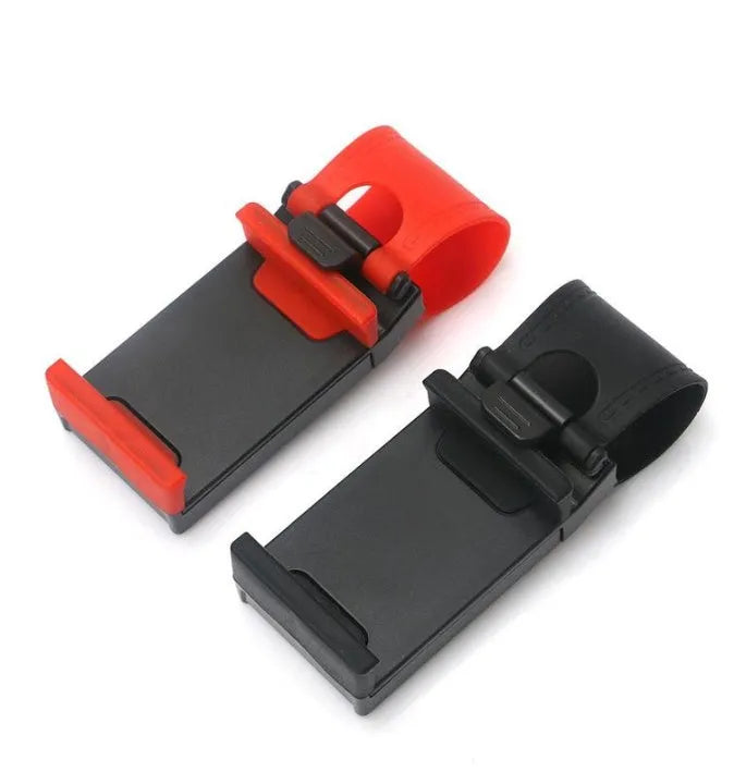 Black universal steering wheel phone clip mount holder attached to a car steering wheel.
