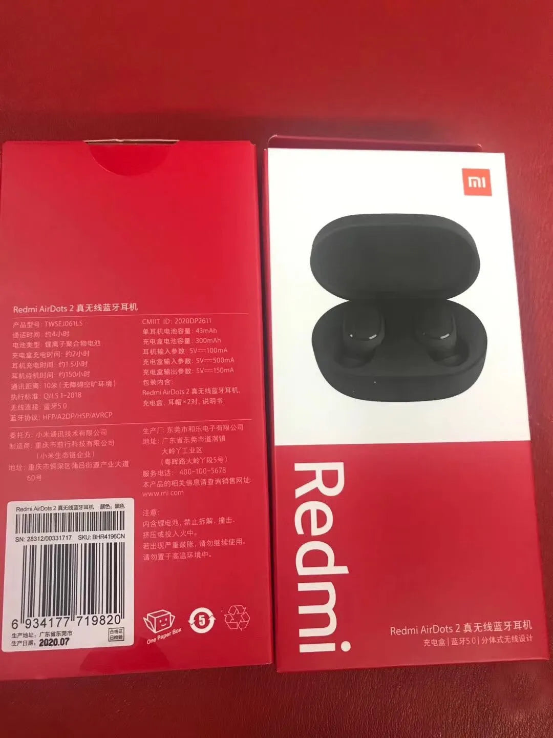 Black Redmi AirDots 2 true wireless earphones with charging case and three sizes of silicone ear tips.