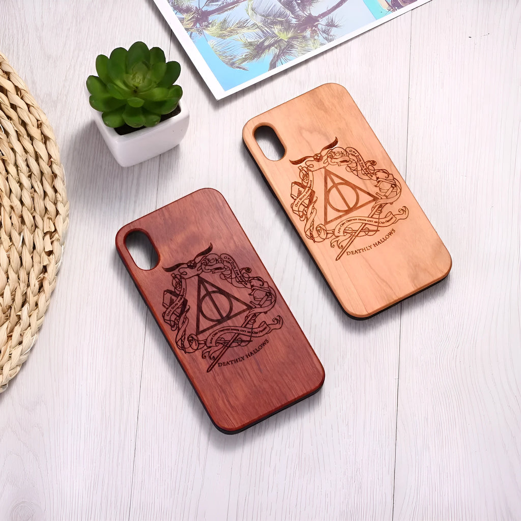 Wooden phone case with laser-carved back and black TPU frame for iPhone.