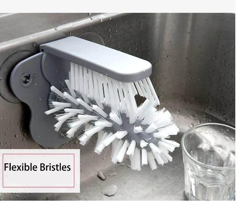 Grey rotating cup brush with dual heads and suction cups for wall mounting