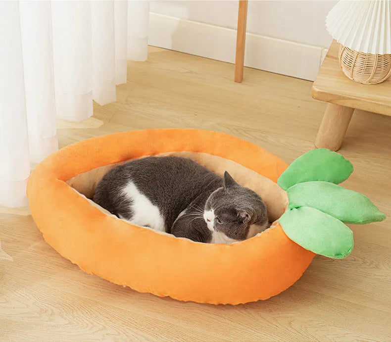 Carrot-shaped plush dog nesting bed with a soft blanket, shown in M and L sizes.